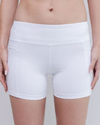 White athletic shorts worn by a person on a plain background